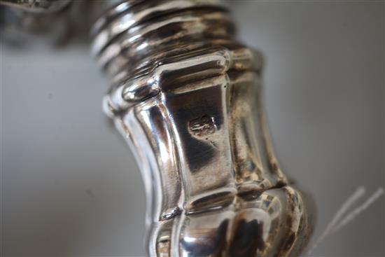 A matched set of four late 18th century silver candlesticks, engraved with the Heneage family crest,